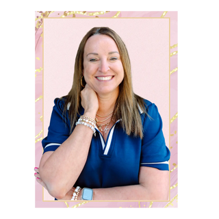 Woman in a blue shirt with jewelry on a pink background. Kendra Kay's Boutique Owner 